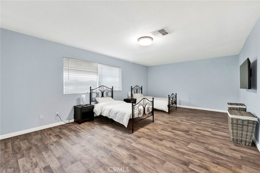 31511 Indian Oak Road Acton, CA 93510 - Photo 16 of 32 a bed room with bed and a tv