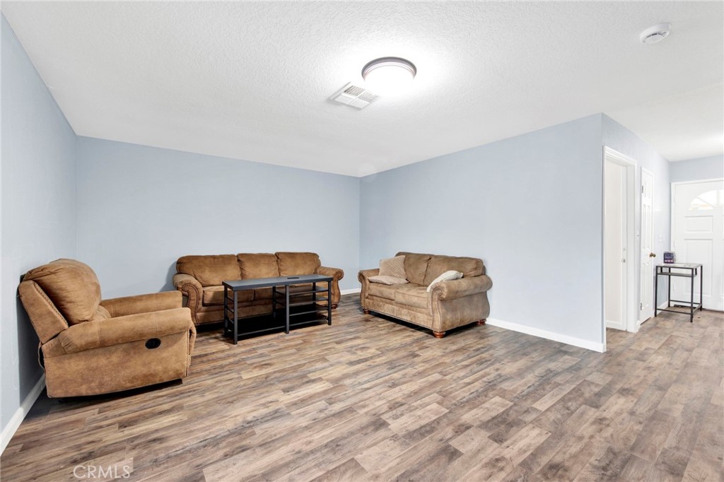 31511 Indian Oak Road Acton, CA 93510 - Photo 4 of 32 a bedroom with furniture and a wooden floor