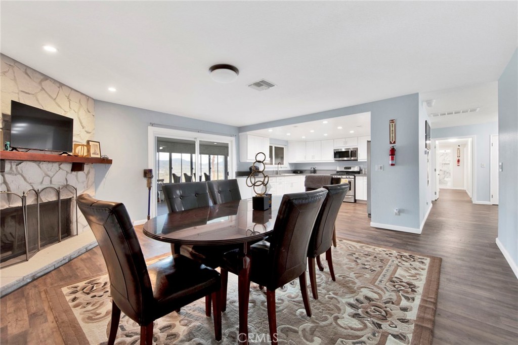 31511 Indian Oak Road Acton, CA 93510 - Photo 5 of 32 a view of a dining room with furniture and wooden floor
