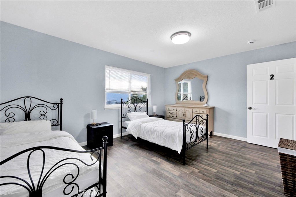 31511 Indian Oak Road Acton, CA 93510 - Photo 9 of 32 a bedroom with a bed and window