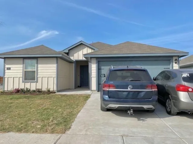 a car parked in front of a house