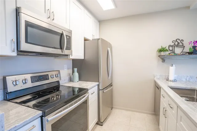 a kitchen with a stove and a microwave