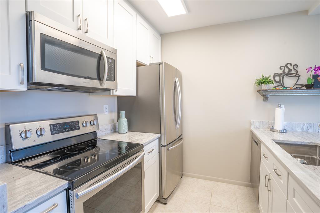 a kitchen with a stove and a microwave