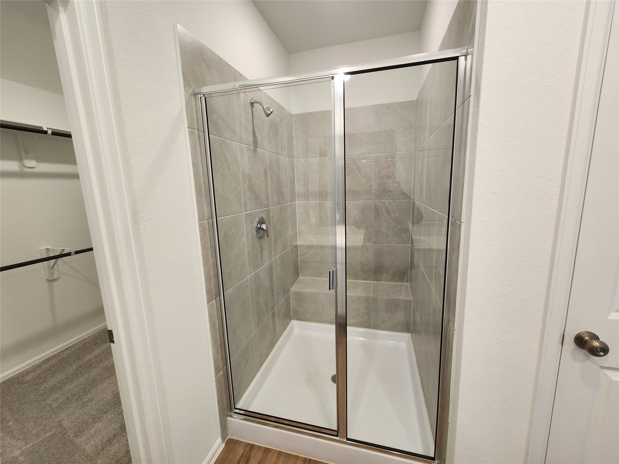 1954 Ballesteros Street Crosby, TX 77532 - Photo 11 of 16 a bathroom with a glass shower door