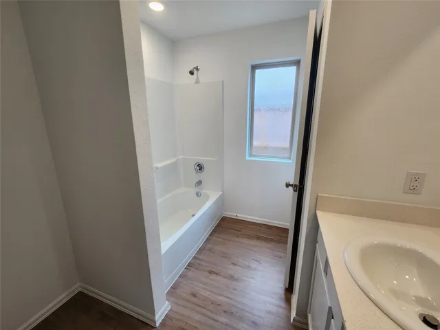 a bathroom with a sink and a bathtub