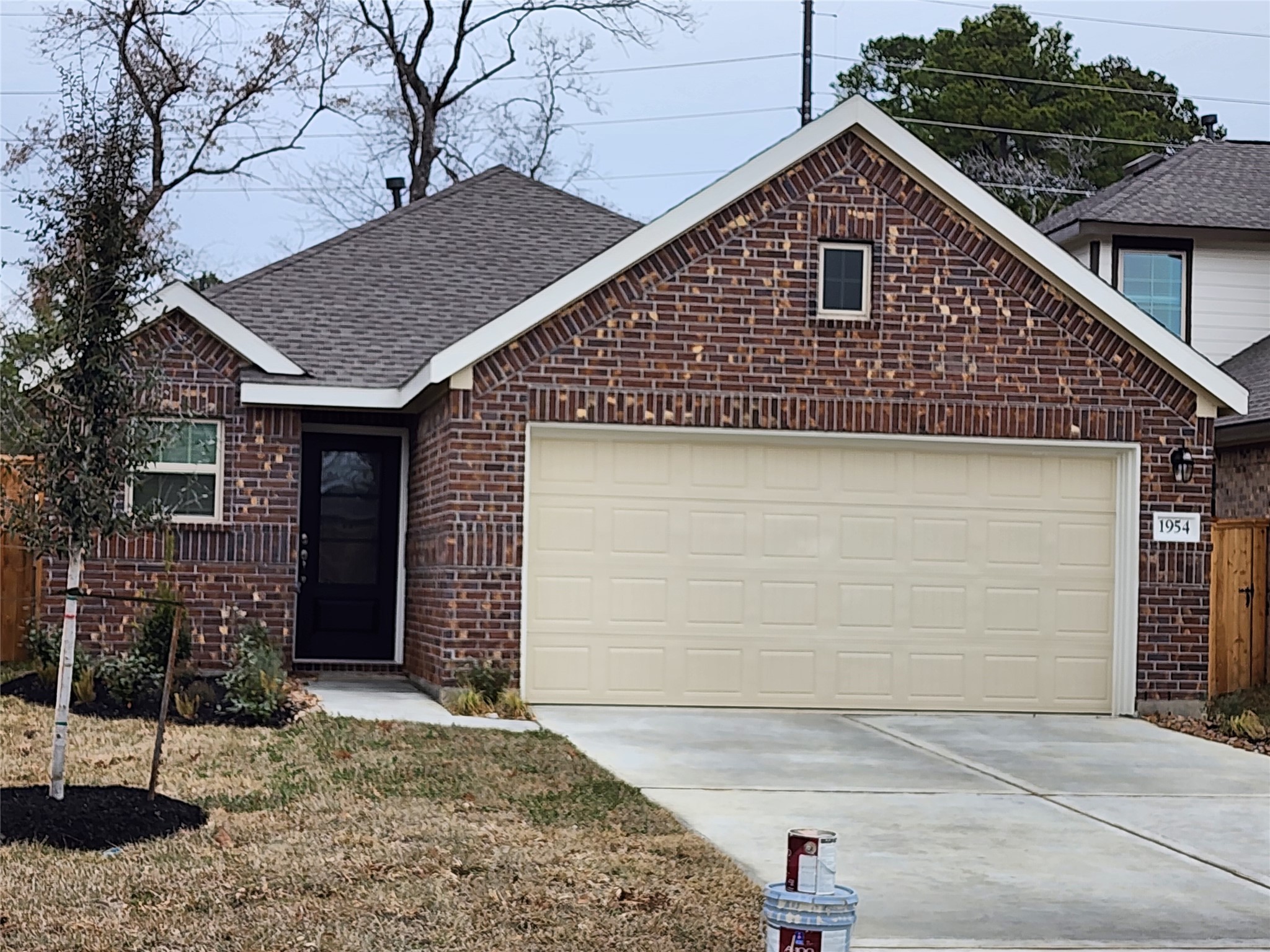 1954 Ballesteros Street Crosby, TX 77532 - Photo 2 of 16 a front view of a house with a yard