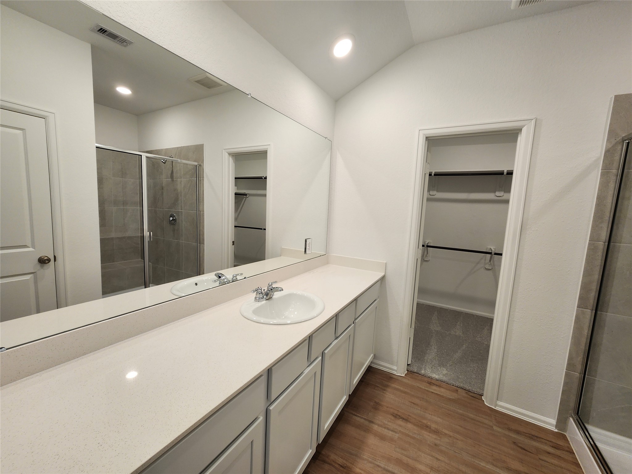 1954 Ballesteros Street Crosby, TX 77532 - Photo 8 of 16 a spacious bathroom with a shower sink and mirror