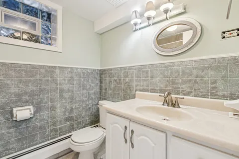 a view of a livingroom with furniture and an empty room