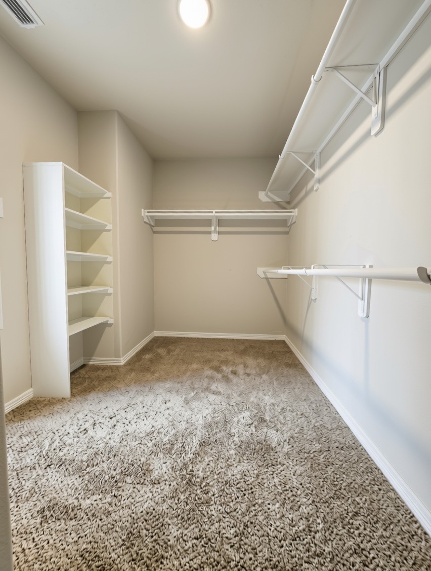 3002 Mayday Run Court Spring, TX 77373 - Photo 17 of 31 Spacious walk-in closet offering generous storage space and easy organization for everyday needs.