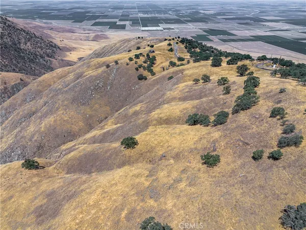 a view of water heater and covered with wooden fence