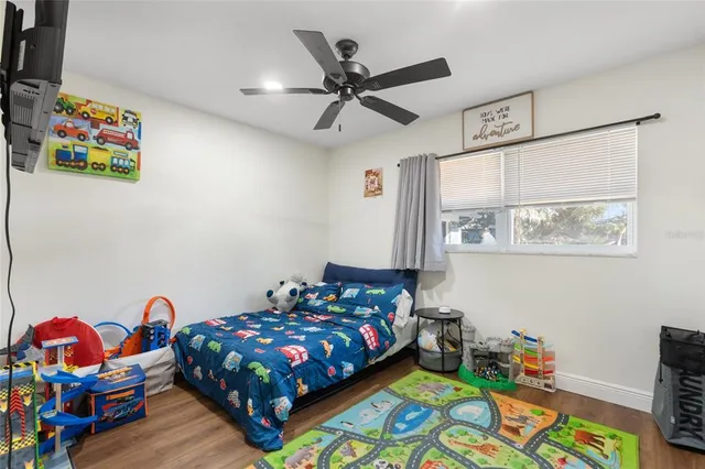 a bedroom with a bed and a window