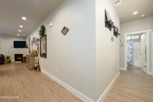 a view of a livingroom with walk in closet and bathroom
