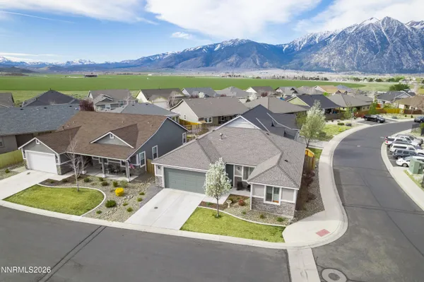 an aerial view of residential houses with outdoor space