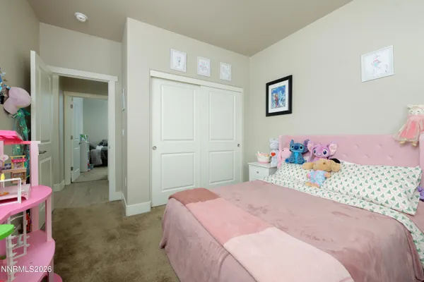a bedroom with a bed and a table