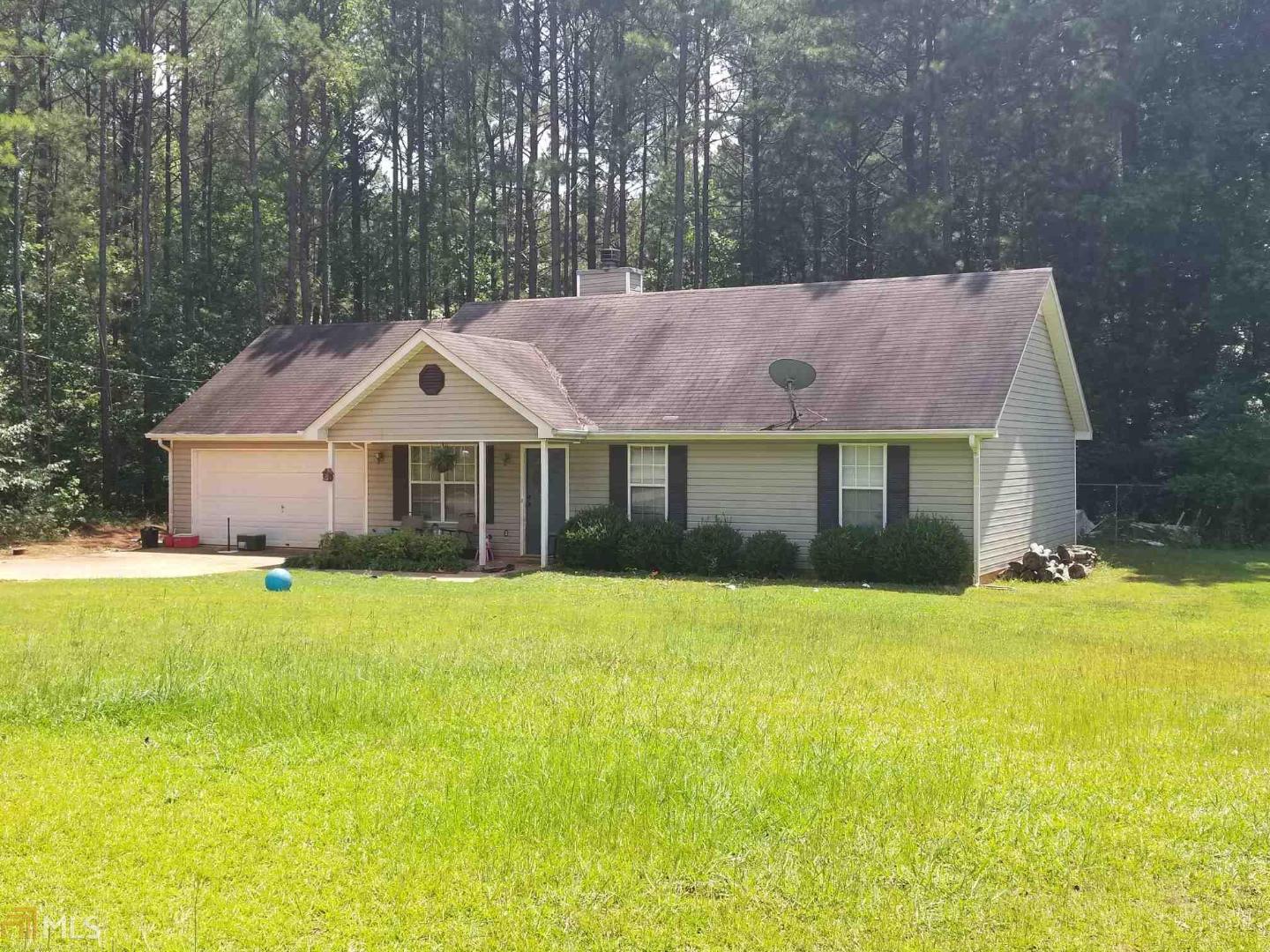 182 Barnetts Bridge Road Jackson, GA 30233 - Photo 1 of 1 a front view of a house with a yard and a garage
