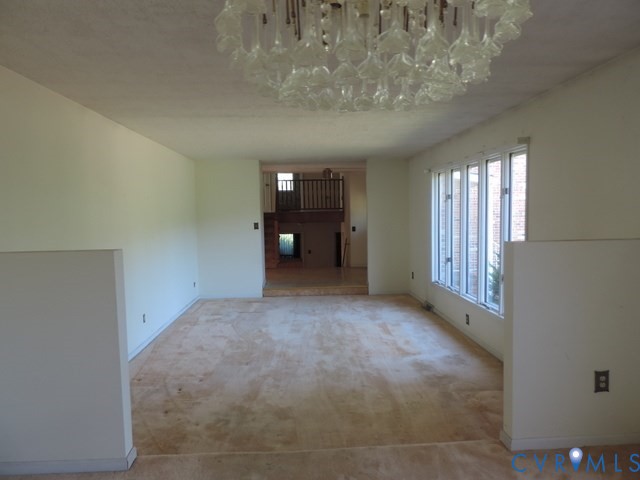 102 Hicks Lane Rice, VA 23966 - Photo 11 of 26 a view of a big room with windows and chandelier