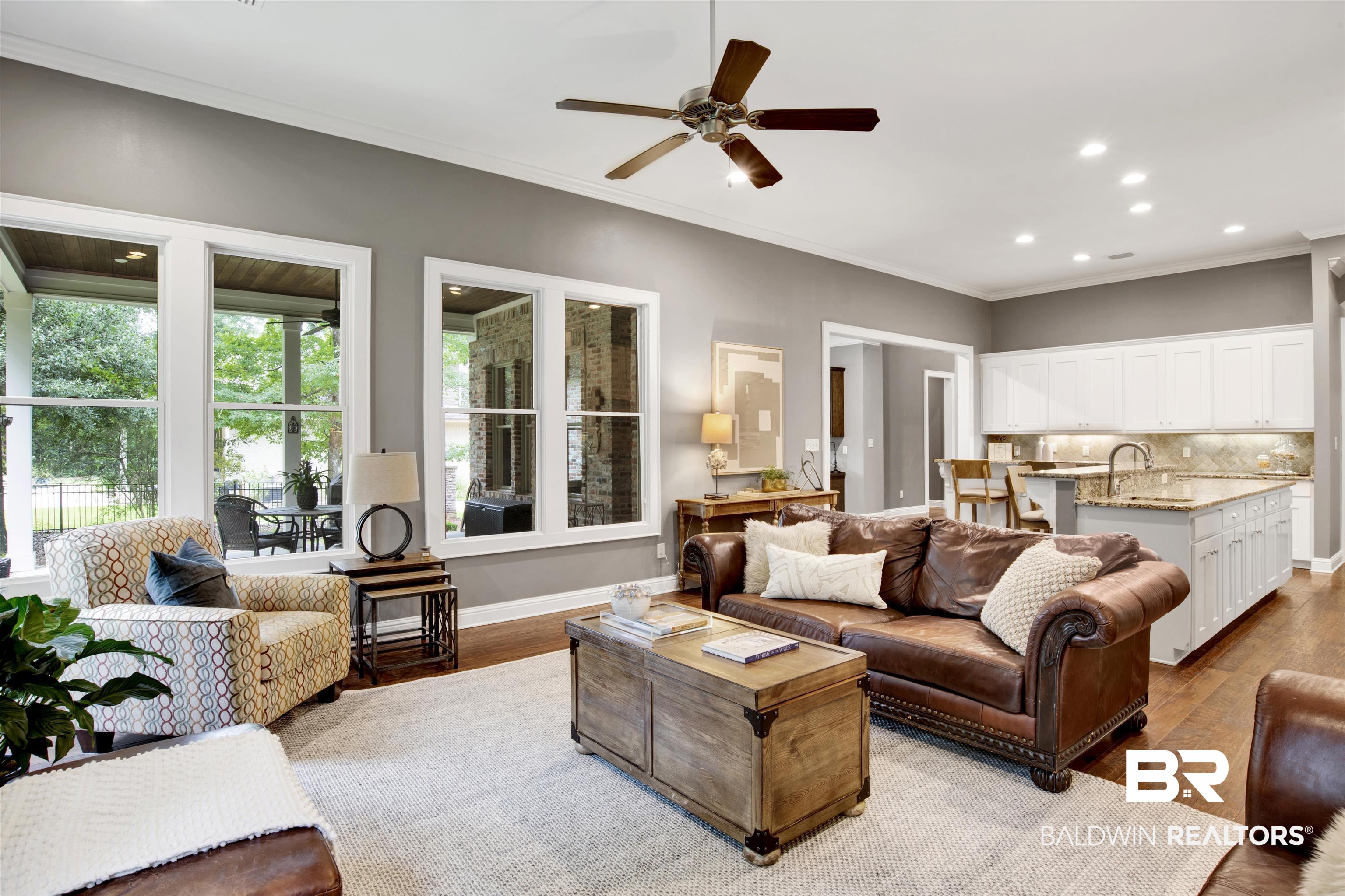 11244 Redfern Road Daphne, AL 36526 - Photo 14 of 50 Living room with ceiling fan, hardwood / wood-style flooring, and ornamental molding
