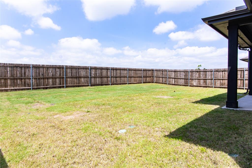 2604 Freeman Street Anna, TX 75409 - Photo 18 of 18 a view of a swimming pool with an outdoor seating area