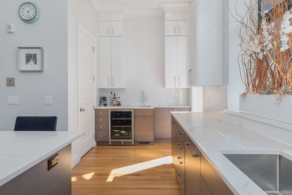 44 Upton Street, Unit 1 Boston, MA 02118 - Photo 12 of 35 a kitchen with granite countertop a sink and a stove