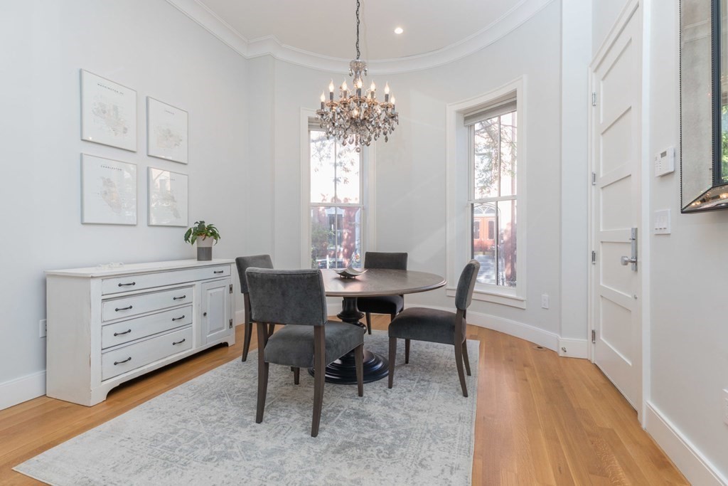 44 Upton Street, Unit 1 Boston, MA 02118 - Photo 14 of 35 a view of a dining room with furniture and window