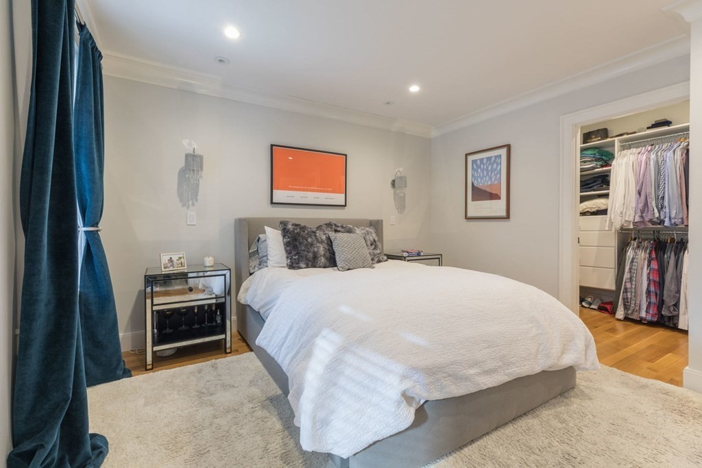 44 Upton Street, Unit 1 Boston, MA 02118 - Photo 16 of 35 a bedroom with a bed and a flat screen tv