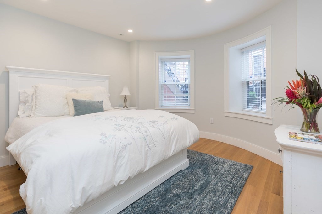 44 Upton Street, Unit 1 Boston, MA 02118 - Photo 18 of 35 a bedroom with a bed and window