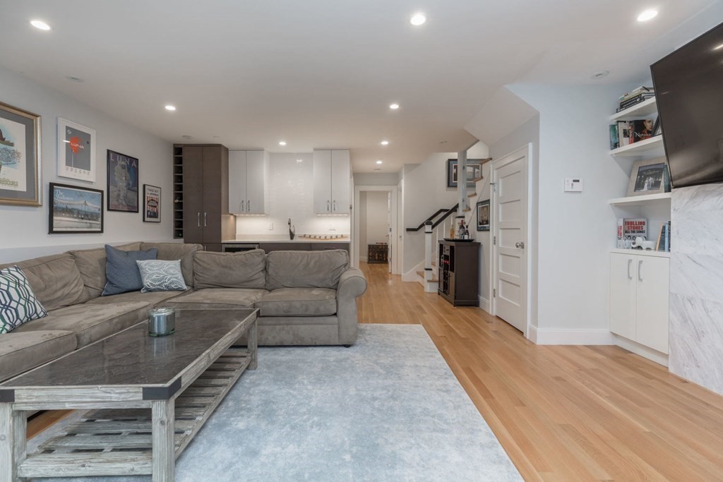 44 Upton Street, Unit 1 Boston, MA 02118 - Photo 21 of 35 a living room with furniture and a flat screen tv