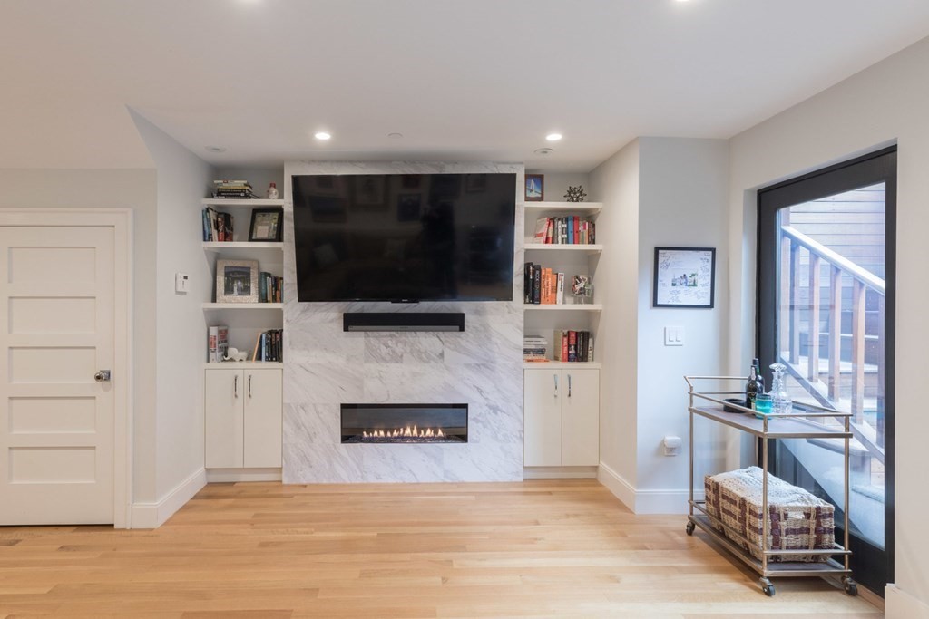 44 Upton Street, Unit 1 Boston, MA 02118 - Photo 22 of 35 a living room with furniture and a flat screen tv