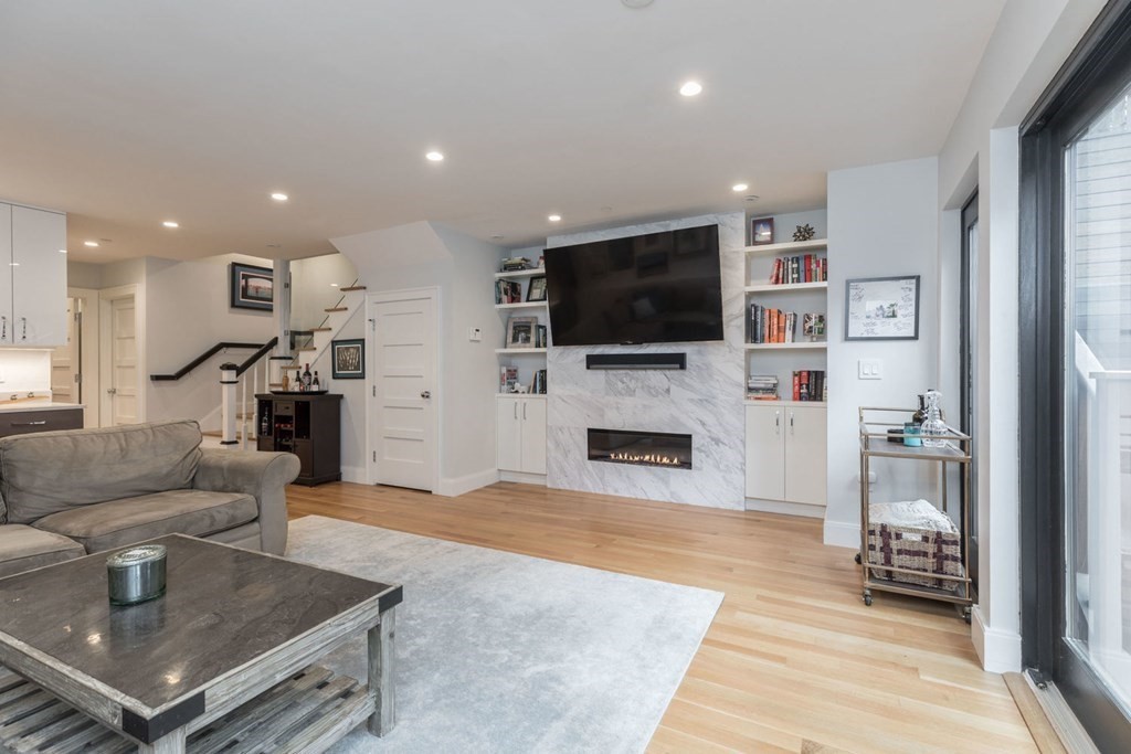 44 Upton Street, Unit 1 Boston, MA 02118 - Photo 23 of 35 a living room with furniture and a flat screen tv