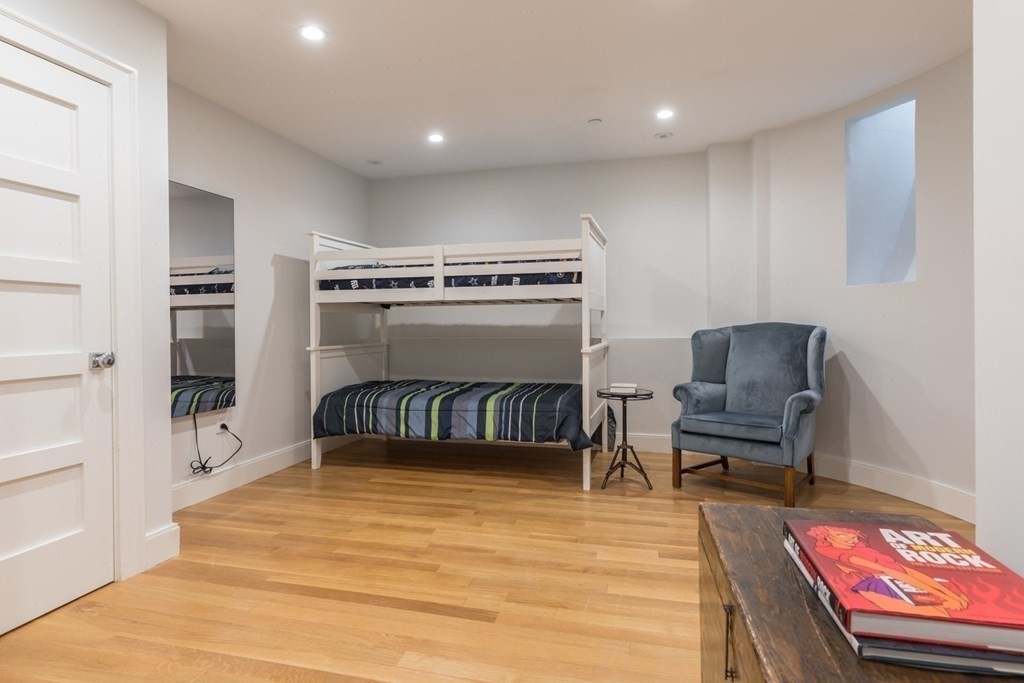 44 Upton Street, Unit 1 Boston, MA 02118 - Photo 25 of 35 a bedroom with furniture and a rug