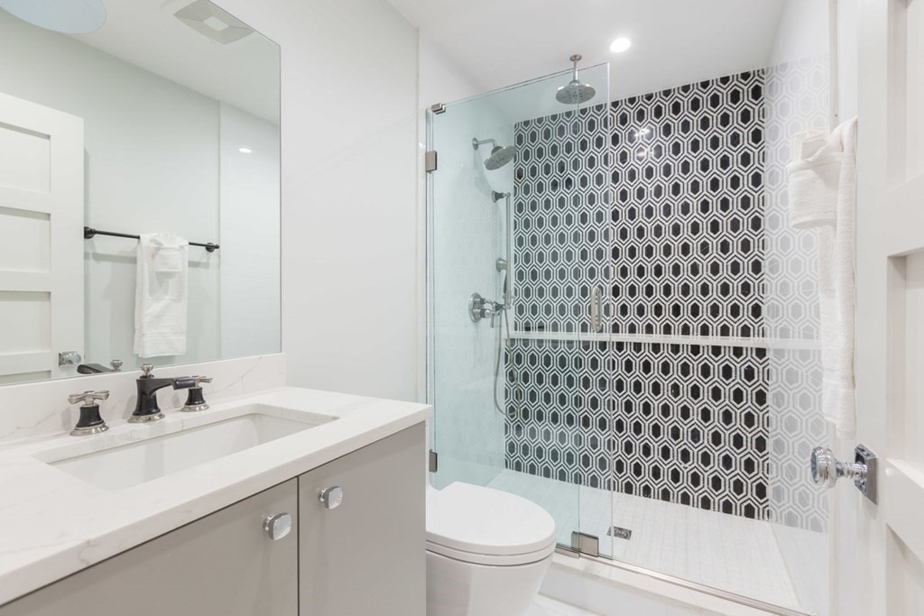 44 Upton Street, Unit 1 Boston, MA 02118 - Photo 27 of 35 a bathroom with a sink a toilet and shower