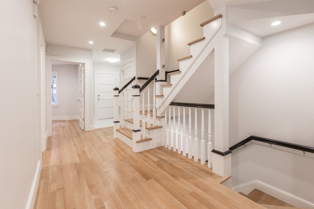 44 Upton Street, Unit 1 Boston, MA 02118 - Photo 30 of 35 a view of entryway with wooden floor and stairs