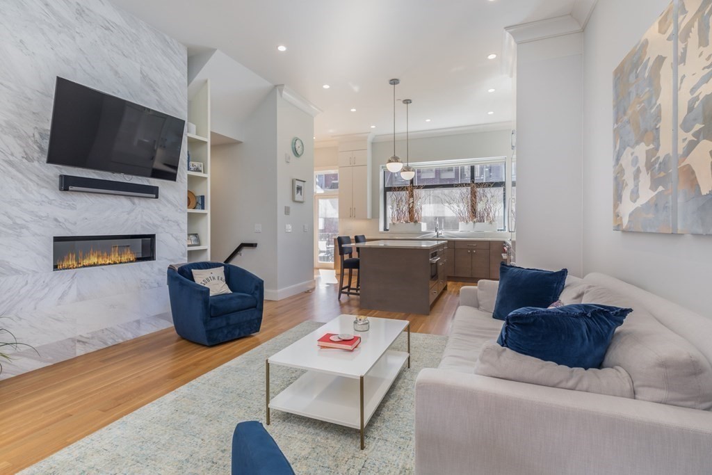 44 Upton Street, Unit 1 Boston, MA 02118 - Photo 3 of 35 a living room with furniture fireplace and flat screen tv