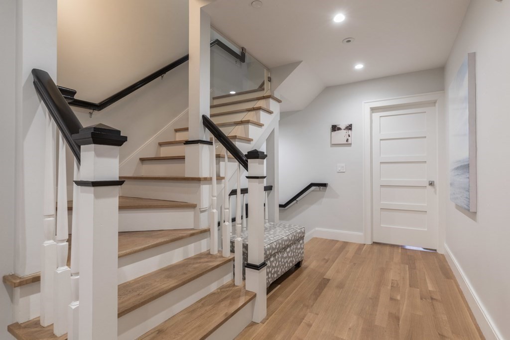 44 Upton Street, Unit 1 Boston, MA 02118 - Photo 31 of 35 a view of entryway with wooden floor and stairs