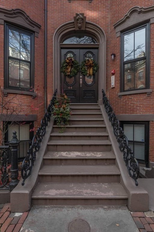 44 Upton Street, Unit 1 Boston, MA 02118 - Photo 34 of 35 a view of entryway and hall with wooden floor