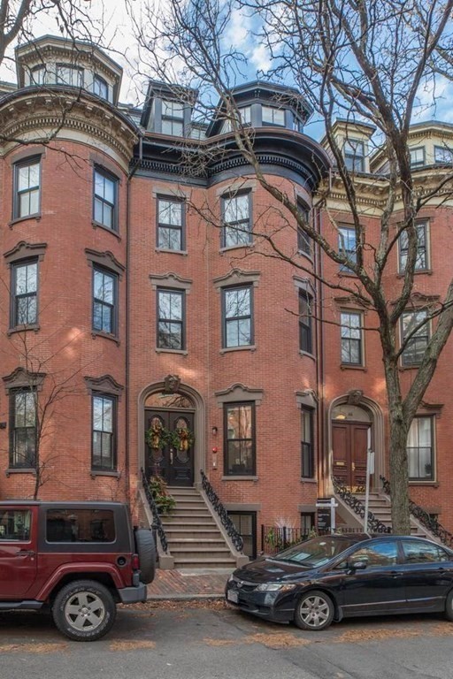 44 Upton Street, Unit 1 Boston, MA 02118 - Photo 35 of 35 a car parked in front of a brick building
