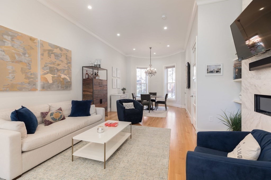 44 Upton Street, Unit 1 Boston, MA 02118 - Photo 4 of 35 a living room with furniture and a couch
