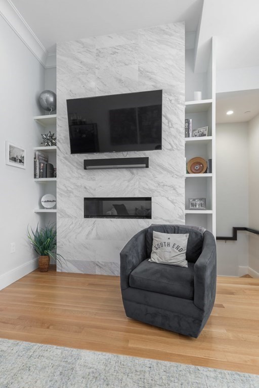 44 Upton Street, Unit 1 Boston, MA 02118 - Photo 6 of 35 a living room with furniture and a flat screen tv