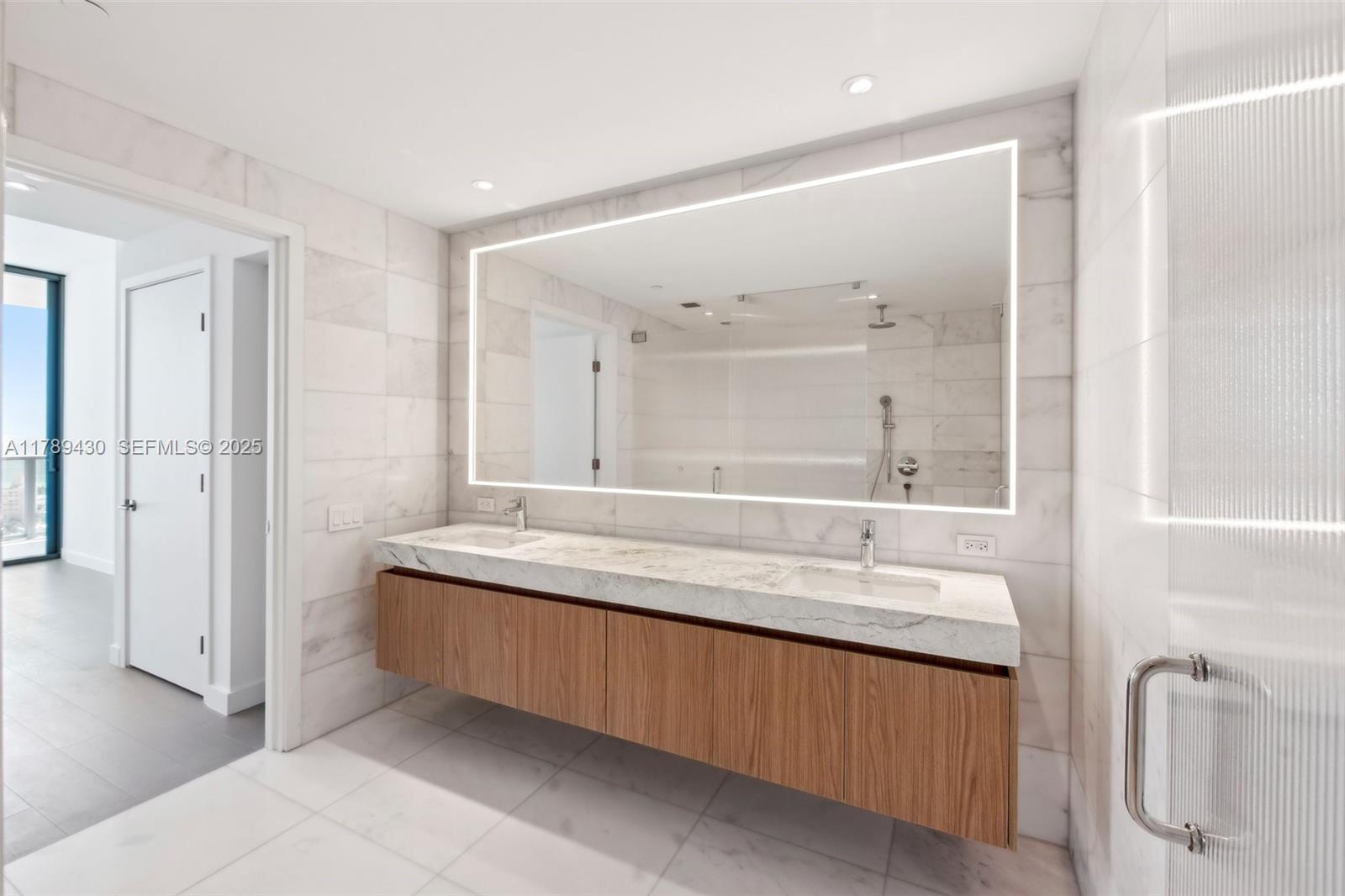 500 Alton Road, Unit 3004 Miami Beach, FL 33139 - Photo 16 of 31 a bathroom with a granite countertop sink mirror and double