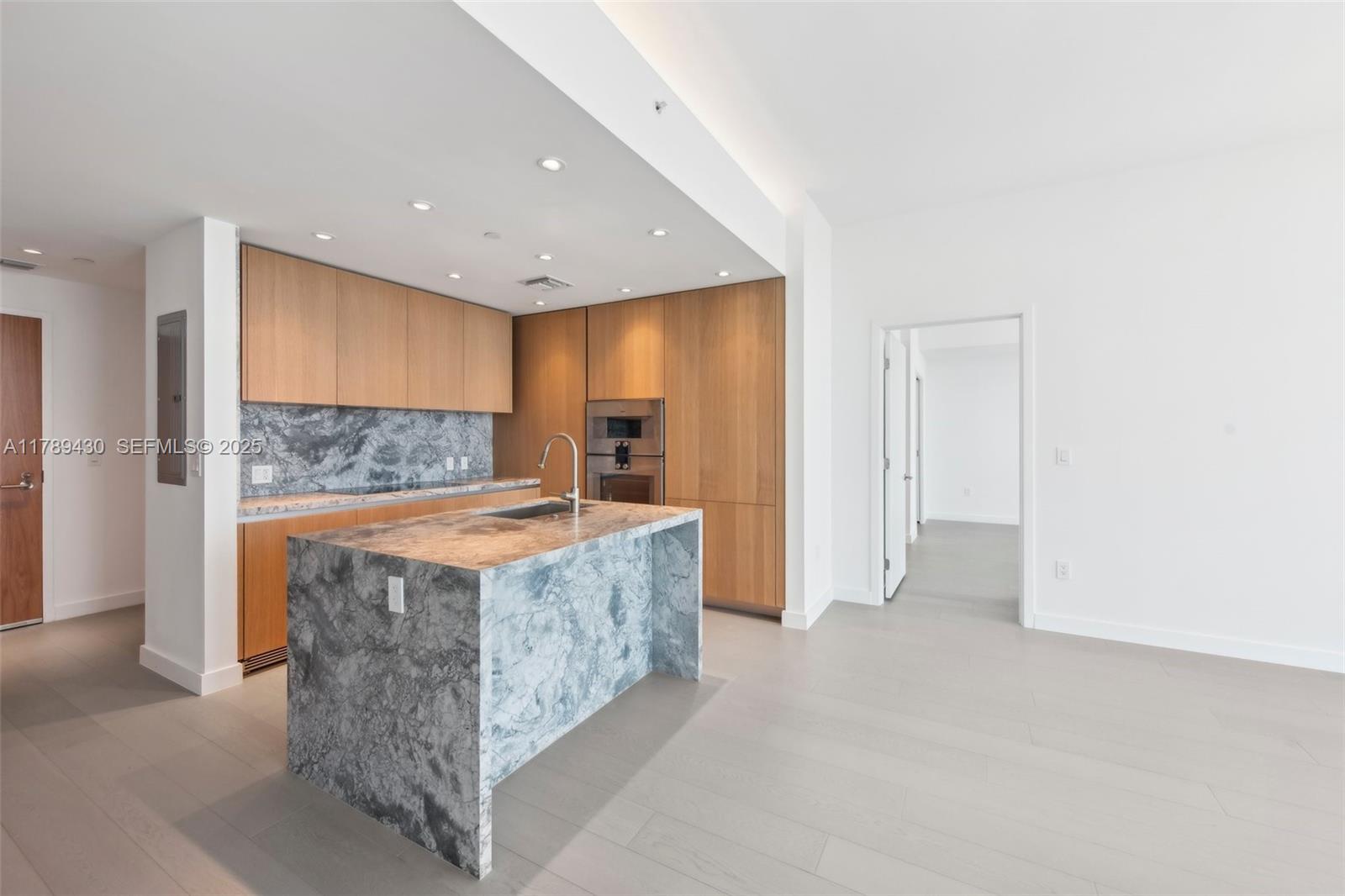 500 Alton Road, Unit 3004 Miami Beach, FL 33139 - Photo 9 of 31 a view of living room with granite countertop furniture and fireplace