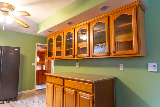 a front view of a building with a garage and balcony