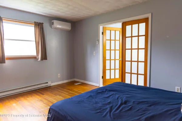 a spacious bathroom with a double vanity sink a mirror and a shower