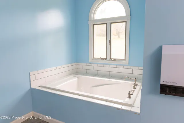 a room with furniture and a flat screen tv