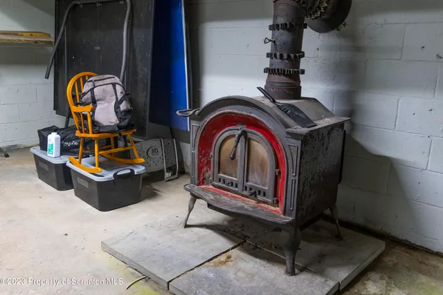 a view of a house with a big yard and large trees