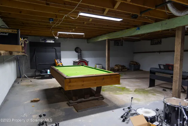 a view of a house with a yard and deck