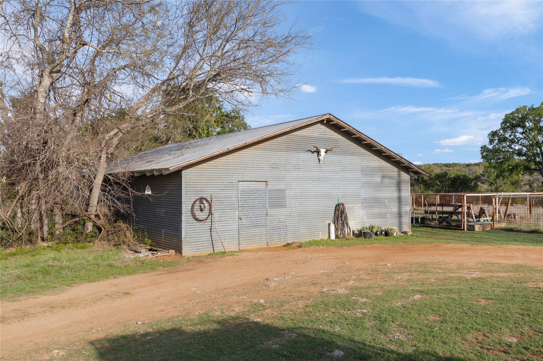 892 Baird Ranch Road Johnson City, TX 78636 - Photo 16 of 39 a view of a house with a yard