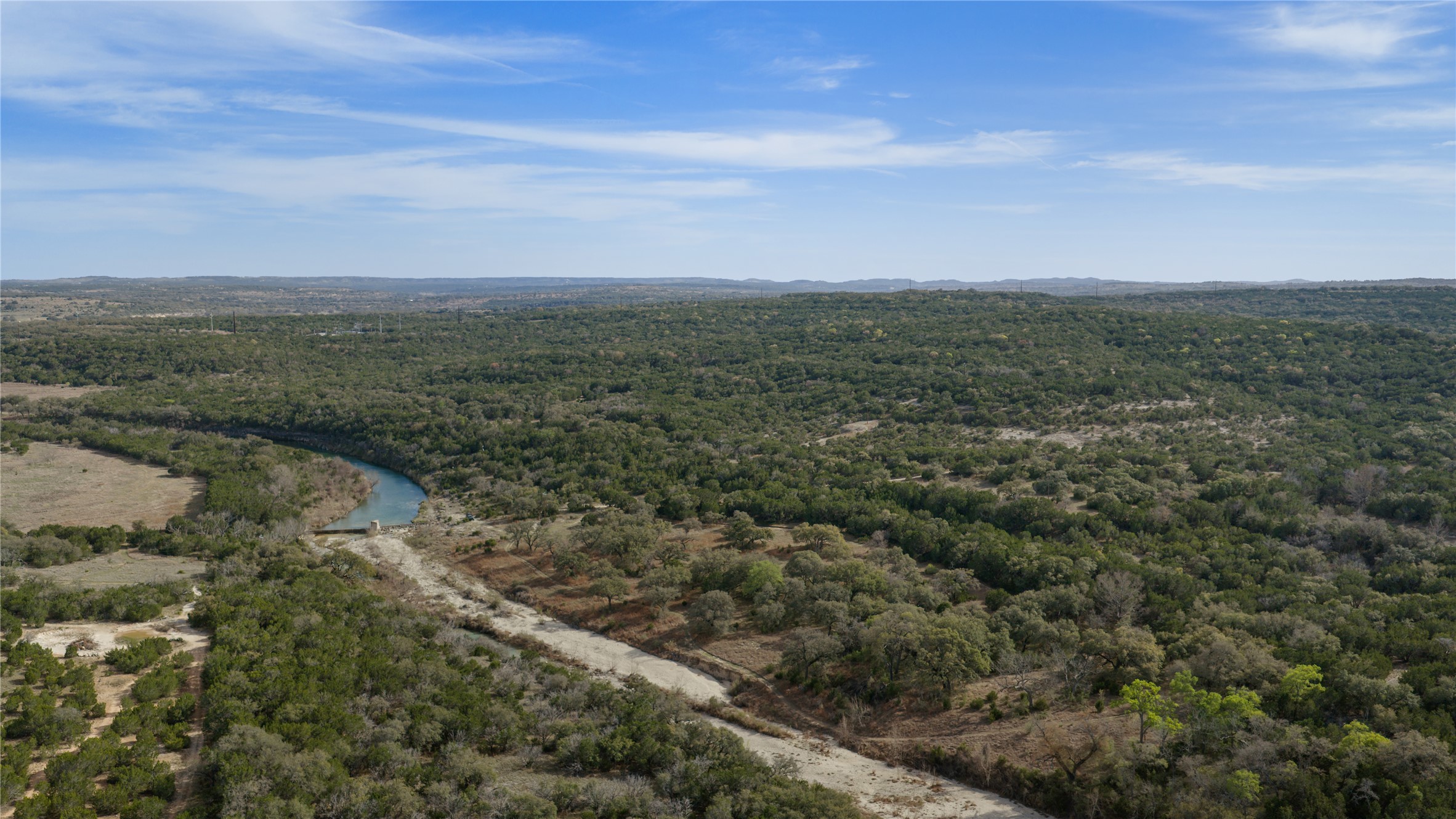 892 Baird Ranch Road Johnson City, TX 78636 - Photo 22 of 39 a view of a city with lush green forest
