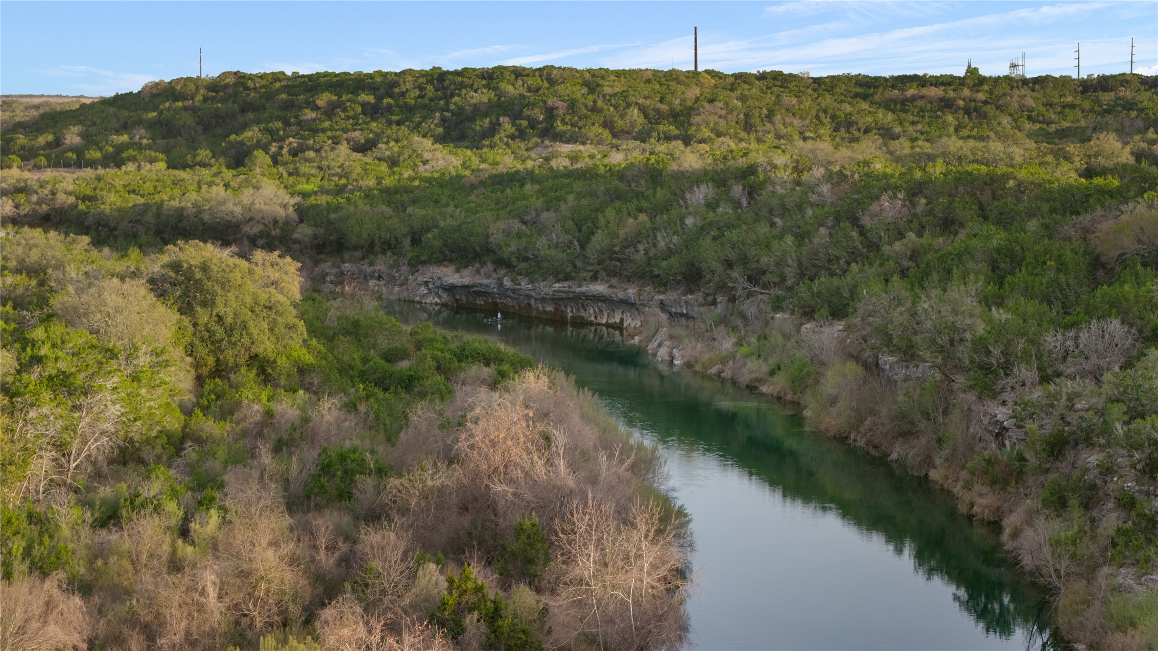 892 Baird Ranch Road Johnson City, TX 78636 - Photo 33 of 39 a view of a lake with a mountain in the background