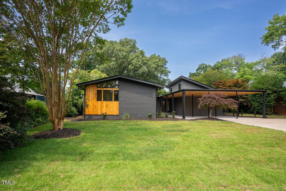 2129 Ridge Road Raleigh, NC 27607 - Photo 1 of 56 a house that has a big yard with large trees