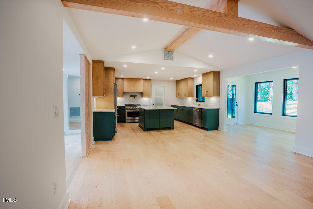 2129 Ridge Road Raleigh, NC 27607 - Photo 13 of 56 a kitchen with stainless steel appliances a refrigerator and a microwave